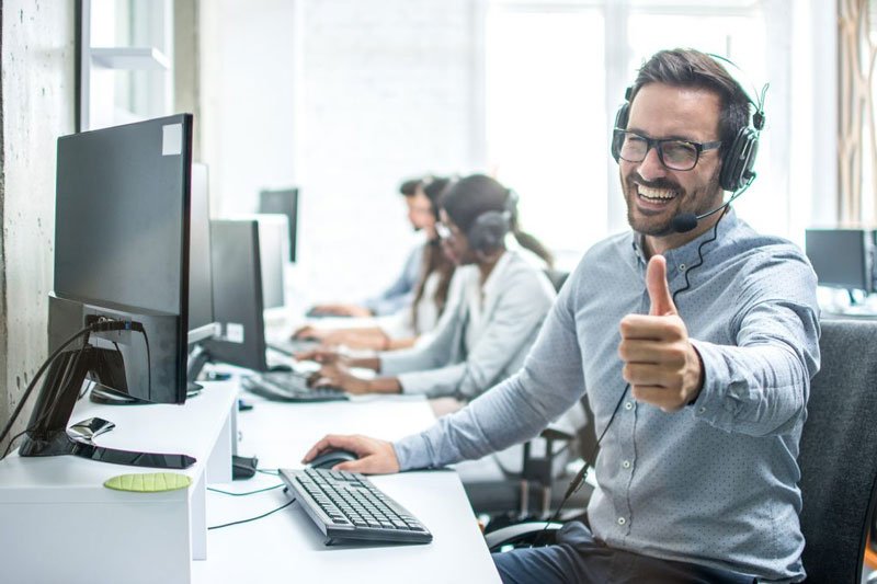 man thumbs up on work