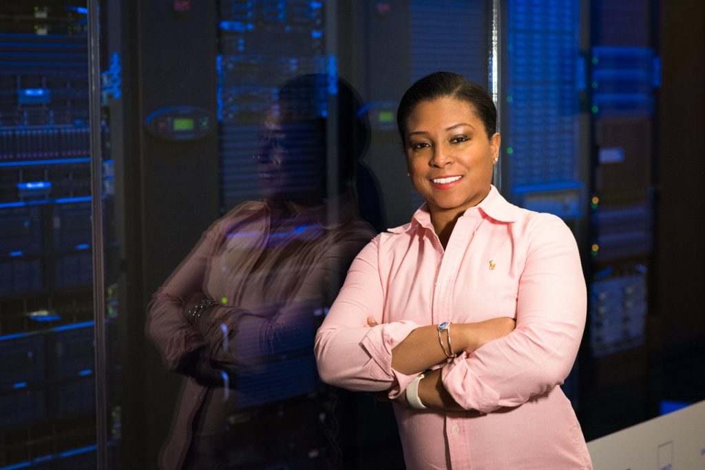 woman standing behind a database