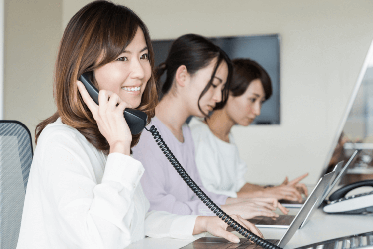 girl answering a call in an office