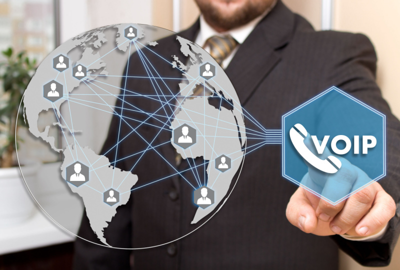 businessman clicks the button VOIP