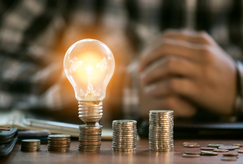 light bulb on one stack of coins