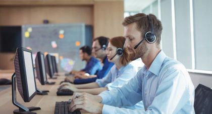 businessman typing on keyboard at call center